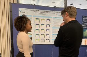 REU Taina presenting summer research poster.